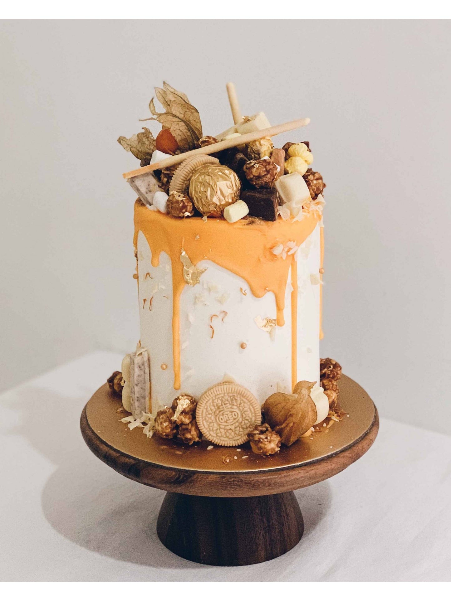 Yellow & White Mad Hatter Drip Cake Singapore | Sarah’s Loft