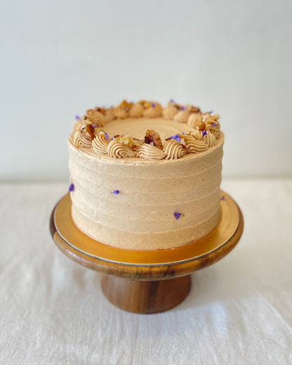 side view of carrot walnut cake with textured frosting Singapore
