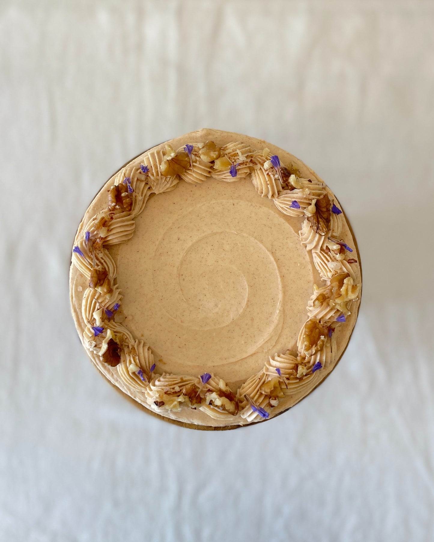 top view carrot walnut cake with walnut topping Singapore
