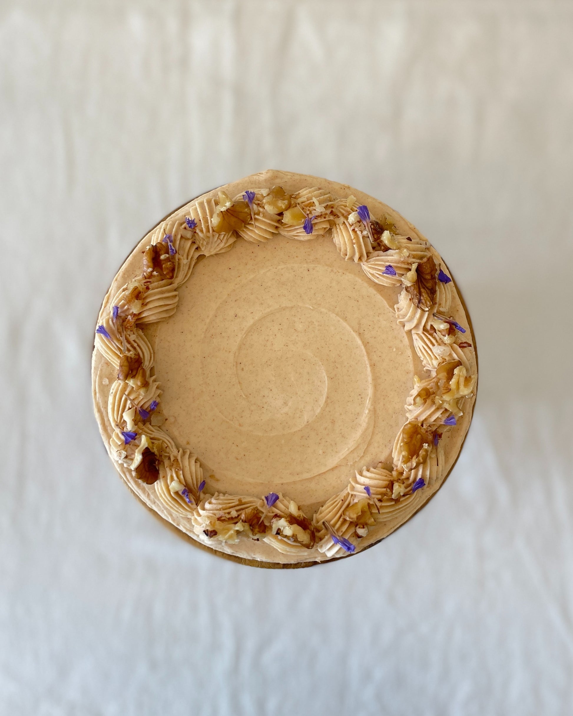 top view carrot walnut cake with walnut topping Singapore